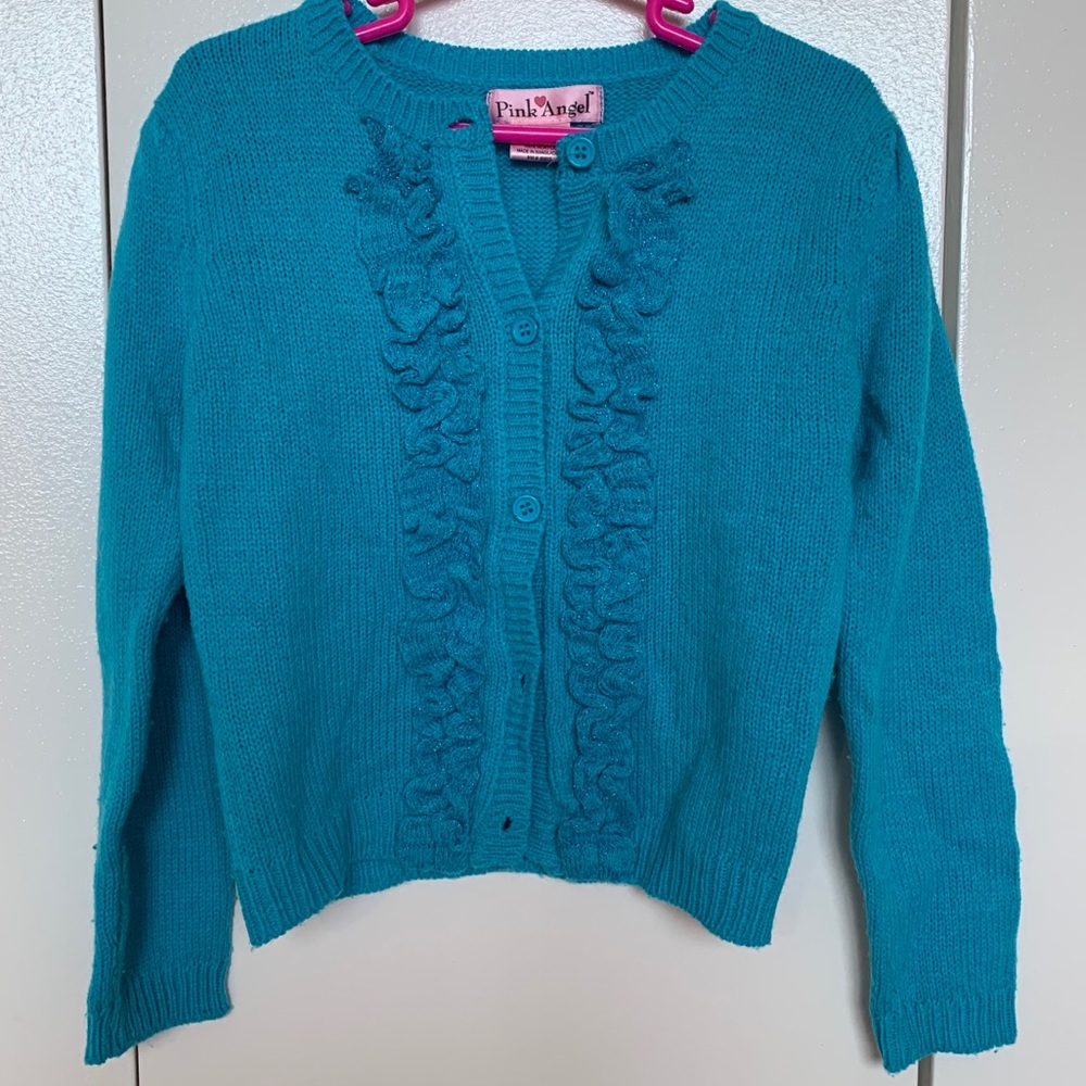 blue cardigan with ruffles
